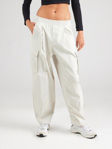 UNDER ARMOUR - Folgado Calças de desporto 'Unstoppable' em branco: frente