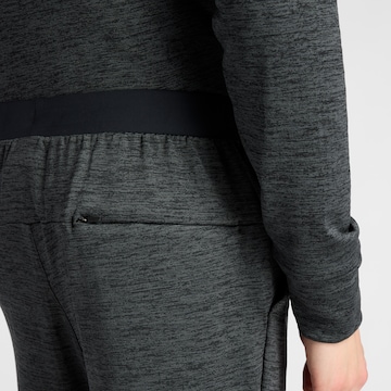 Effilé Pantalon de sport 'Athletics Heat Grid' new balance en noir