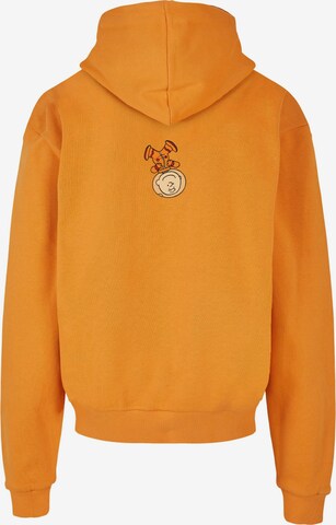 Merchcode Sweatshirt 'Peanuts - Charlie' in Orange