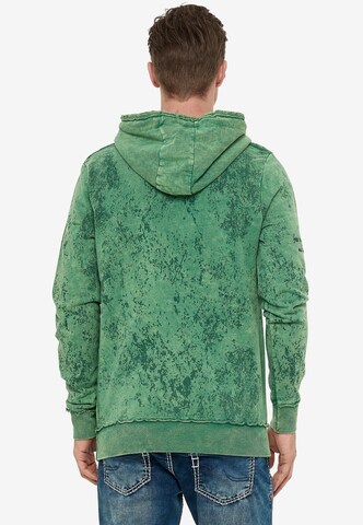 Rusty Neal Sweatshirt in verwaschenem Look mit Schriftzug in Grün