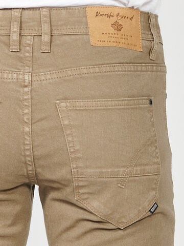 Coupe slim Jean KOROSHI en marron