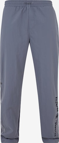 Karl Kani Lużny krój Spodnie w kolorze szary: przód