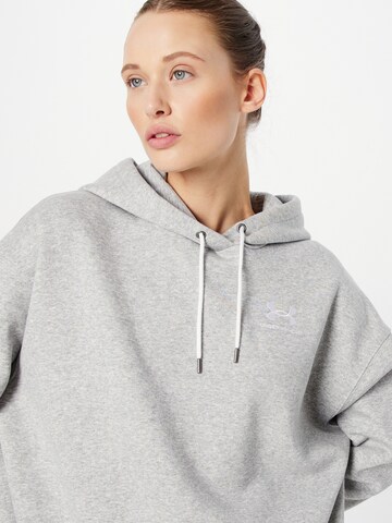 UNDER ARMOUR - Sweatshirt de desporto em cinzento