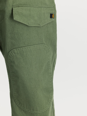 ALPHA INDUSTRIES Loose fit Cargo trousers 'CWU-18/P' in Green: side