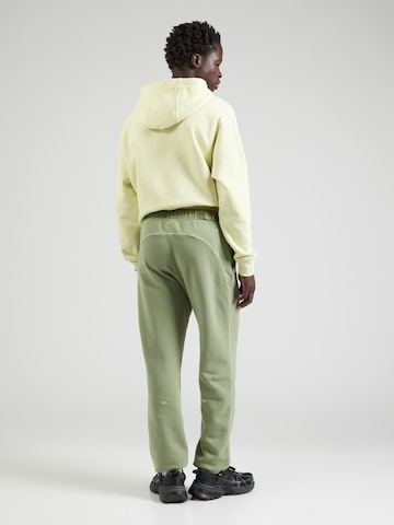 Nike Sportswear Tapered Hose 'NOCTA' in Grün: Rückseite