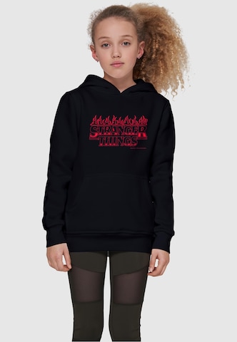 ABSOLUTE CULT Sweatshirt 'Stranger Things - Flames' in Zwart: voorkant