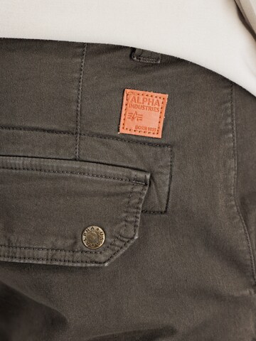 ALPHA INDUSTRIES Tapered Cargo trousers 'Combat' in Brown