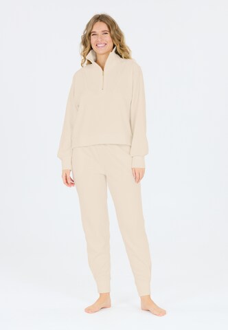 Athlecia Regular Sports trousers in Brown