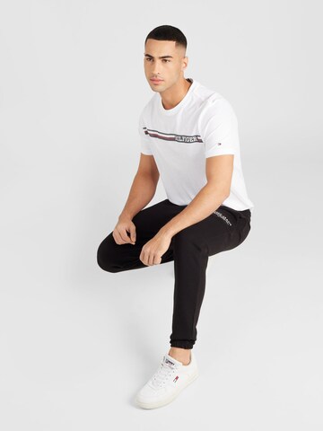 Tapered Pantaloni de la Tommy Jeans pe negru