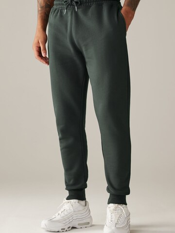 Tapered Pantaloni di Next in verde: frontale