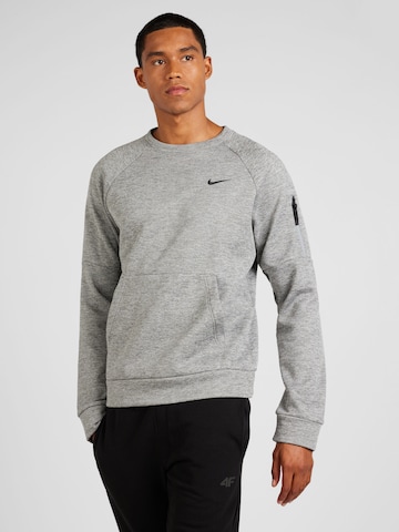 Sweat de sport NIKE en gris : devant