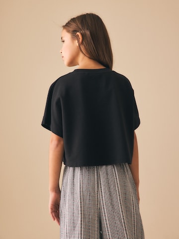 T-Shirt Next en noir