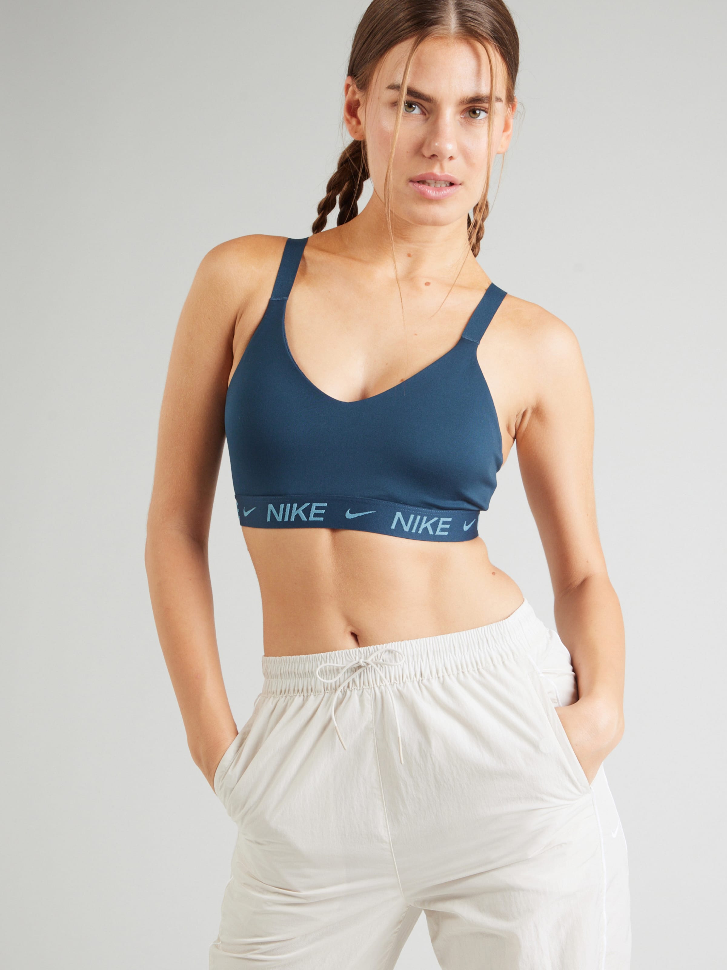NIKE Bralette Sports bra INDY in Marine Blue Light Blue ABOUT YOU