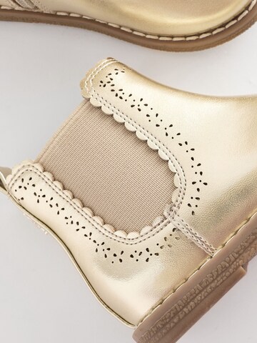 Bottes Next en or