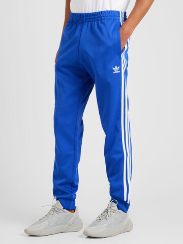 ADIDAS ORIGINALS Дънки Tapered Leg Панталон 'Adicolor Classics Sst' в синьо: отпред
