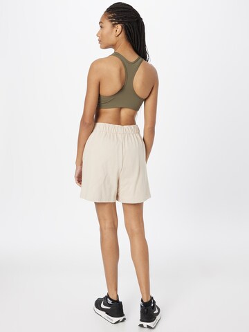 Nike Sportswear Loose fit Trousers in Beige