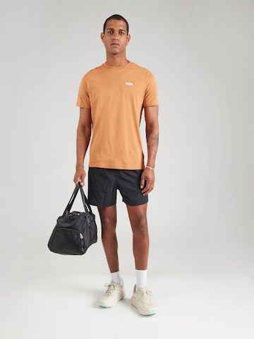 PUMA Functioneel shirt 'ESS No. 1' in Bruin