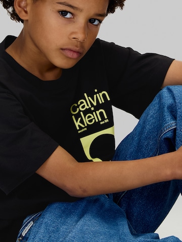 Calvin Klein Jeans Póló 'CITY SCENE' - fekete