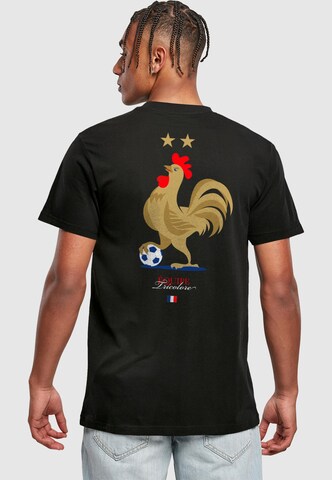 Maglietta 'Équipe Tri Color 2.0' di Mister Tee in nero: frontale