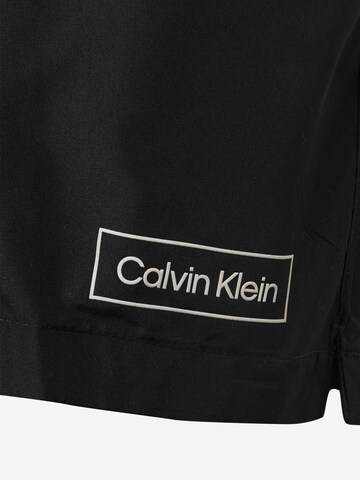 Calvin Klein Swimwear شورت سباحة بلون أسود