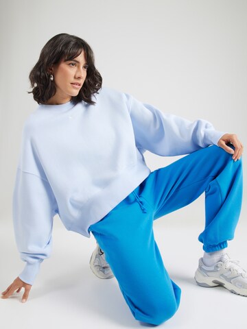 Nike Sportswear Sweatshirt 'Phoenix Fleece' in Blauw