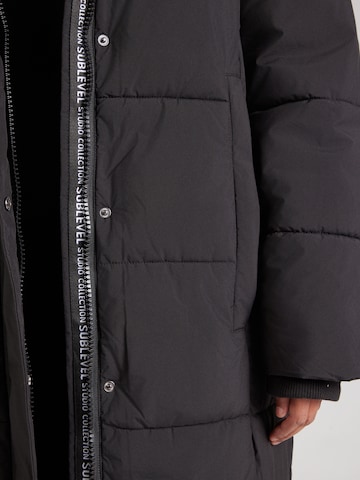 juoda Sublevel Žieminis paltas