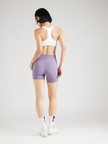 NIKE Skinny Spodnie sportowe 'ONE' w kolorze fioletowy