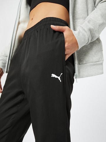 PUMA Tapered Sports trousers in Black