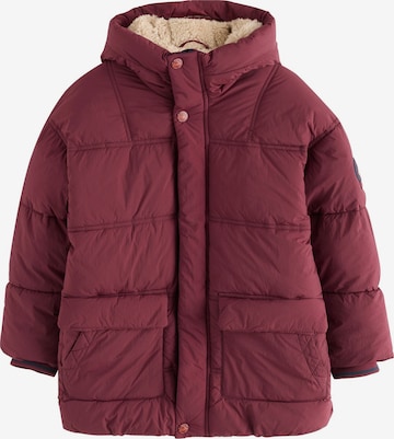 Next Pitkä takki värissä punainen: etupuoli