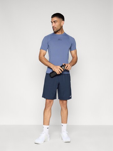 NIKE Свободный крой Спортивные штаны 'FLEX' в Синий