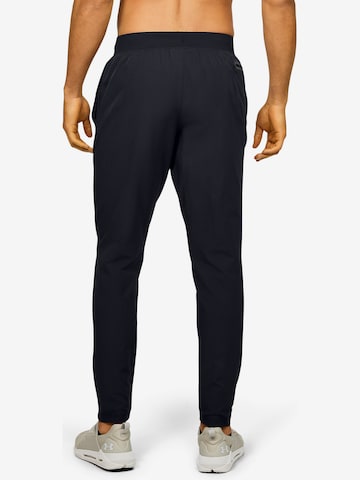 UNDER ARMOUR Tapered Urheiluhousut 'Unstoppable' värissä musta