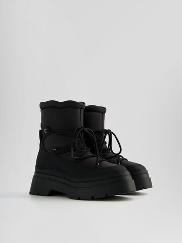 Bershka Snowboots in Zwart