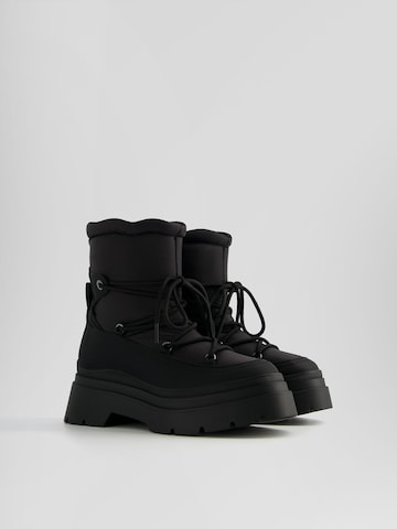 Bershka Snow boots in Black