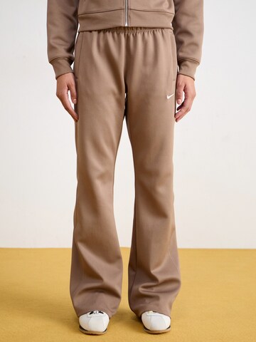Nike Sportswear Flared Trousers in Brown: front