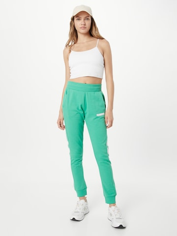 Hummel Ozke Športne hlače | zelena barva