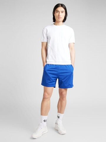 Champion Authentic Athletic Apparel Regular Trousers in Blue