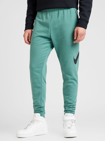 NIKE Tapered Sportbyxa i grön: framsida