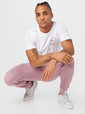 ADIDAS ORIGINALS Tapered Pants 'Adicolor Essentials Trefoil' in Pink