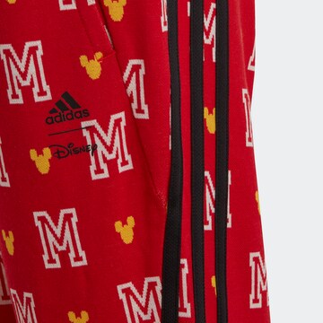 ADIDAS SPORTSWEAR Slimfit Urheiluhousut 'Disney Mickey Mouse' värissä punainen