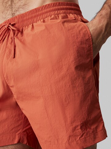 Pantaloncini da bagno di Calvin Klein Swimwear in arancione