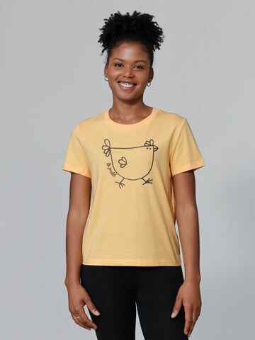 Watapparel Shirt 'Le poulet - das Huhn' in Oranje: voorkant