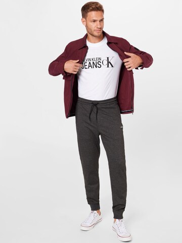 Calvin Klein Jeans - Tapered Pantalón 'MILANO' en gris