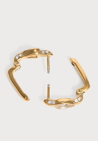Cercei 'CRYSTAL LOVE' de la GUESS pe auriu