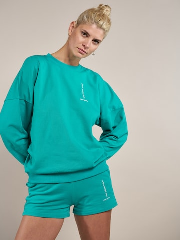 ABOUT YOU x Laura Giurcanu Sweatshirt 'Luca' in Green: front
