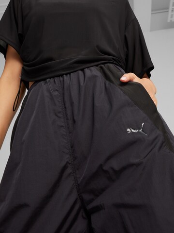 PUMA Široke hlačnice Hlače 'DARE TO' | črna barva