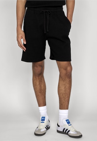 Urban Classics Regular Trousers in Black: front