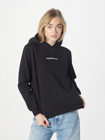 Sweat-shirt Calvin Klein Jeans en noir : devant