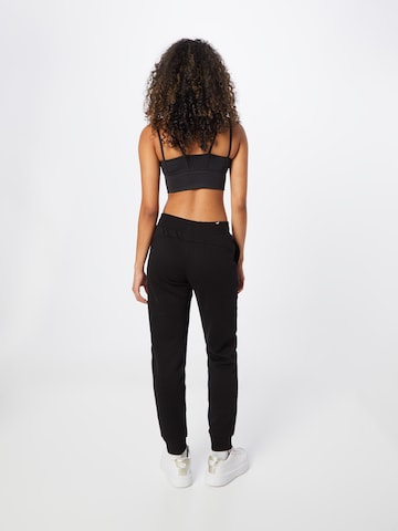 Effilé Pantalon de sport PUMA en noir