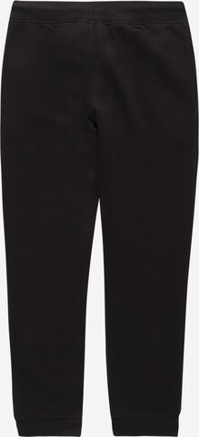 Champion Authentic Athletic Apparel Tapered Trousers in Black