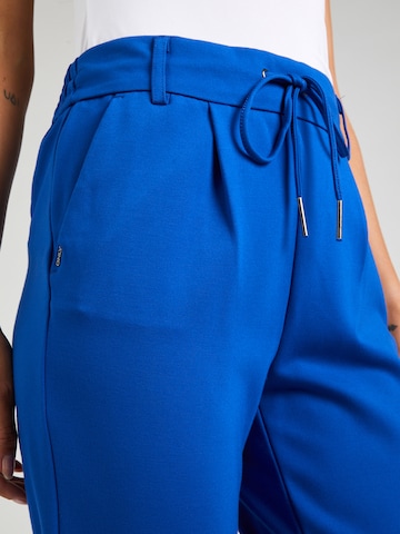 ONLY Liibuv Voltidega püksid 'Poptrash', värv sinine